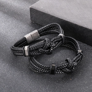 Men's minimalist black woven leather bracelet with magnetic stainless steel clasp detail