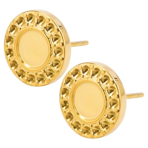 Close-up of golden stainless steel round stud earrings with textured dot pattern
