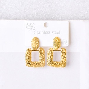 Golden geometric earrings with irregular texture and stainless steel backing card