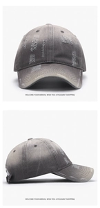 Close-up of distressed washed cotton baseball cap with vintage frayed holes and metal buckle