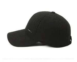Side view of black winter baseball cap for men with warm ear flaps and metal detail