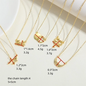 Set of 18K gold-plated necklaces with crab, dragon, and moon pendants on white background