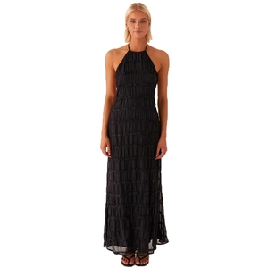 Detail of black halter neck dress featuring premium pleated texture and flowing ankle-length cut