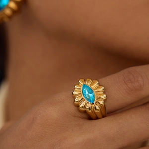 18K gold plated stainless steel ring with blue marquise gemstone in floral setting
