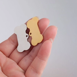 Polished bone-shaped stainless steel dog tag pendants in silver and gold finishes