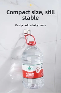 Adhesive stainless steel hook showing strong weight capacity with a water jug on marble wall