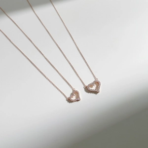Elegant S925 sterling silver hollow heart necklace with rose gold finish and zircon stones