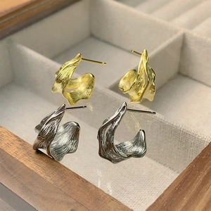 Minimalist irregular foil texture stud earrings in gold and silver metal finishes