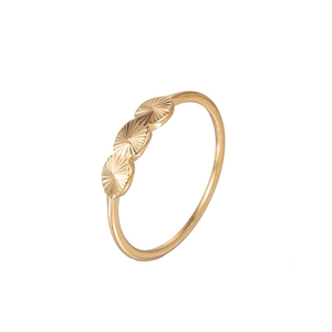 Detailed view of a gold ring featuring three textured circular ornaments with sunburst patterns