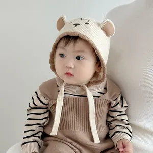Close-up of soft knit baby hat with bear ears and warm cotton lining for winter