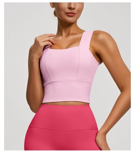 Detail of light pink square neck sports bra and rose red high waist yoga pants set