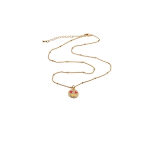 Detailed close-up of heart-eye smiley face pendant on gold-plated copper necklace