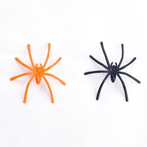 Black and orange plastic spiders for Halloween decorations and prank prop accessories