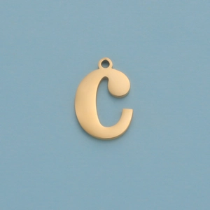 Detail of a golden letter C pendant with a mirror finish on a clean blue background
