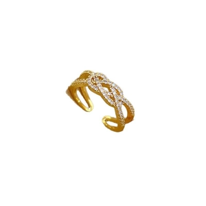 Gold-plated open cross twist ring with micro-pave cubic zirconia on white background