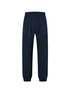 Navy blue waffle knit joggers with drawstring waist and unique textured paneling