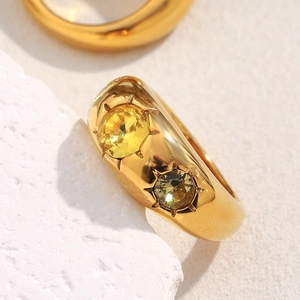 Macro detail of 18K gold plated stainless steel ring set with sparkling zircon stones