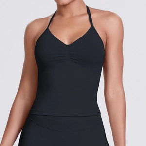 Close-up of seamless black halter yoga top featuring fine fabric texture and neat stitching