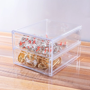 Detailed side view of clear two-tier acrylic organizer box for jewelry and rings