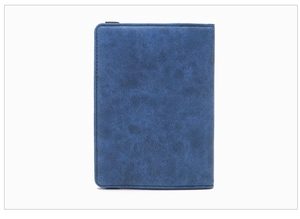Detailed view of the blue leather texture and neat edge stitching on the RFID passport holder