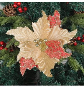 Macro detail of artificial Christmas poinsettia with red champagne petals and gold glitter