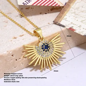 Dettaglio del ciondolo a girasole dorato con zircone blu e misure dimensionali esatte