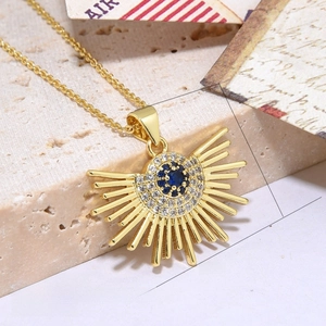 Detail showing gold sunflower pendant with blue zircon and exact size measurements