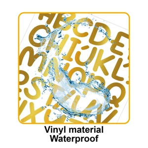 Macro view of gold vinyl letter stickers with water droplets showing waterproof durability