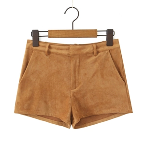 Detail of brown faux suede shorts with smooth texture and classic tailored cut
