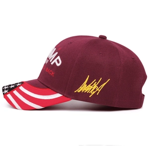 Deep red Trump 2024 baseball cap with America embroidery and American flag brim detail