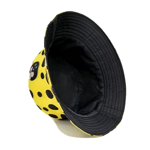 Reversible yellow bucket hat with polka dots and cartoon mouse embroidery on cotton fabric