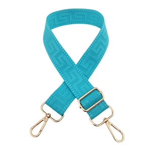 Detail of dark blue Greek fret patterned wide bag strap with gold metal swivel hooks
