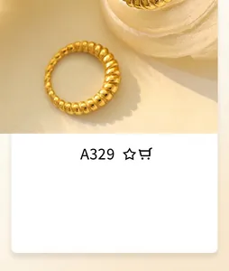 Macro view of C-shaped hoop earrings with a textured vintage croissant forged design