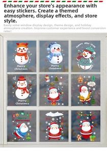 Macro view of Christmas window stickers featuring Santa Claus, snowman and gingerbread house
