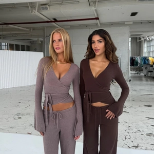 Women's 2-piece knit set featuring V-neck wrap top and wide-leg pants in earthy tones