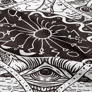 Close-up of woven fabric texture showing Scorpio zodiac and mystical eye pattern