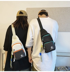 Rear view of waterproof nylon chest bags in black and white styles on models