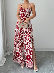 Detail view of the red and white floral print jumpsuit featuring elegant side slits