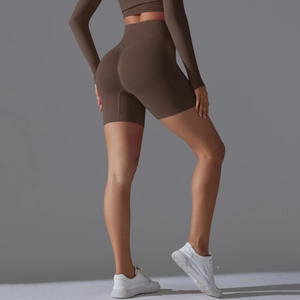 Detailed back view of high-waisted seamless scrunch butt yoga shorts in dark brown