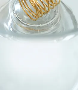 Detailed view of multilayer golden spiral ring with minimalist wrap-around metal wire design