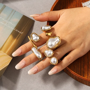 Baroque irregular pearl ring set in gold stainless steel shown on model hand