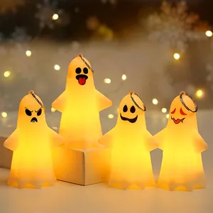 Set of four Halloween ghost lanterns with glowing warm light and varied spooky expressions