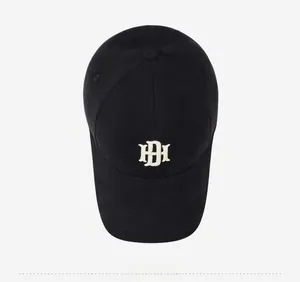 Top view of black cotton baseball cap showing HDH embroidery and fine stitching detail