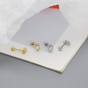 Close-up of S925 sterling silver stud earrings with cubic zirconia and screw ball backs