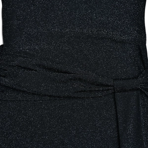 Macro detail of dark blue shimmering fabric with elegant knotted pleats and textures