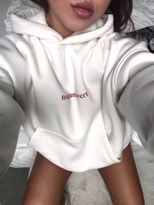 Oversized white hoodie featuring red toxic introvert embroidery in a relaxed fit