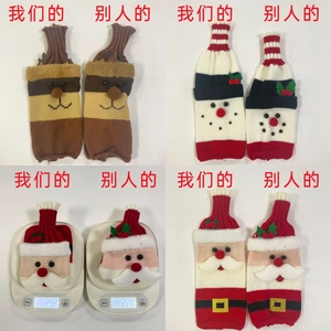 Comparison showing weights of various knitted Christmas wine bottle covers with holiday patterns