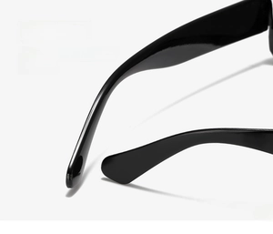 Close-up of sleek black curved temples on modern rectangular sunglasses