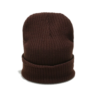 Close-up of the dark brown ribbed knit beanie texture and thick fold-up cuff detail