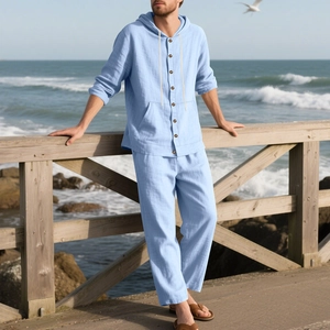 Close-up of light blue linen blend hooded shirt and trousers set worn on a beach pier